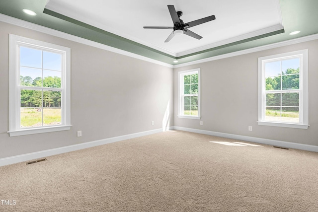 4924 Zebulon Rd, Zebulon, NC 27597 - carpeted empty room featuring a tray ceiling, ornamental molding, a ceiling fan, and recessed lighting