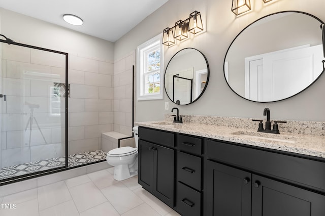 4924 Zebulon Rd, Zebulon, NC 27597 - full bath featuring double vanity, a tile shower, and tile patterned flooring