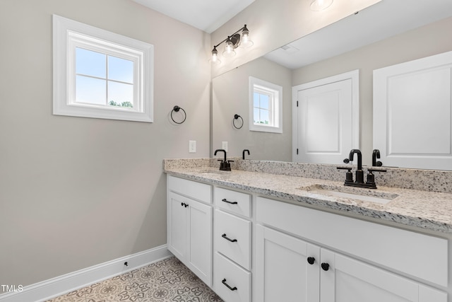 4924 Zebulon Rd, Zebulon, NC 27597 - bathroom featuring double vanity and baseboards