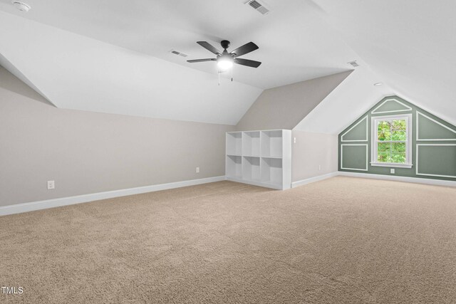 4924 Zebulon Rd, Zebulon, NC 27597 - additional living space with vaulted ceiling, carpet, and a ceiling fan