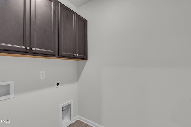 233 Stone River Dr, Wendell, NC 27591 - washroom with wood finished floors, electric dryer hookup, baseboards, cabinet space, and hookup for a washing machine