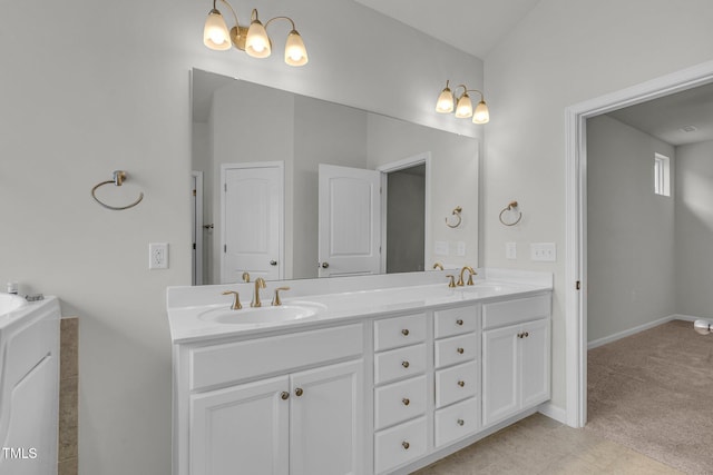 233 Stone River Dr, Wendell, NC 27591 - bathroom with double vanity, baseboards, and a sink