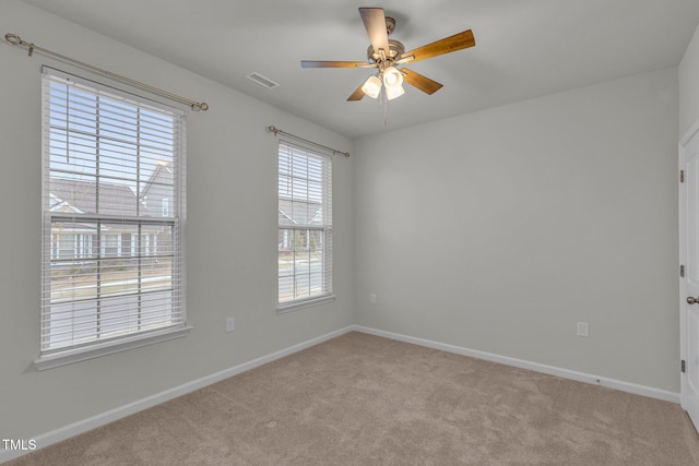 233 Stone River Dr, Wendell, NC 27591 - empty room featuring light carpet, baseboards, ceiling fan, and visible vents