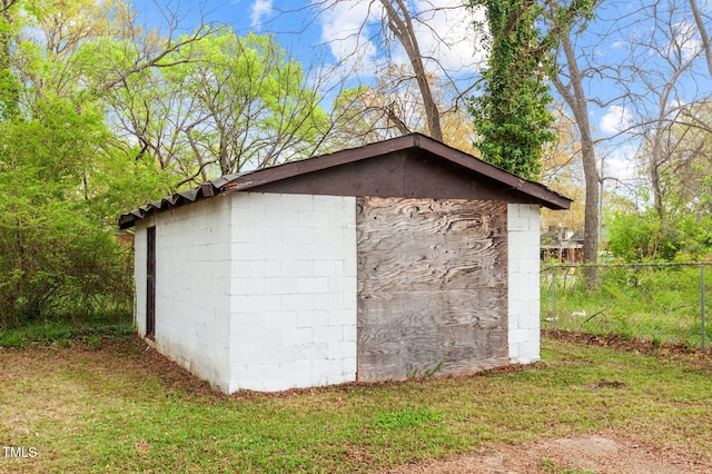 view of shed with fence