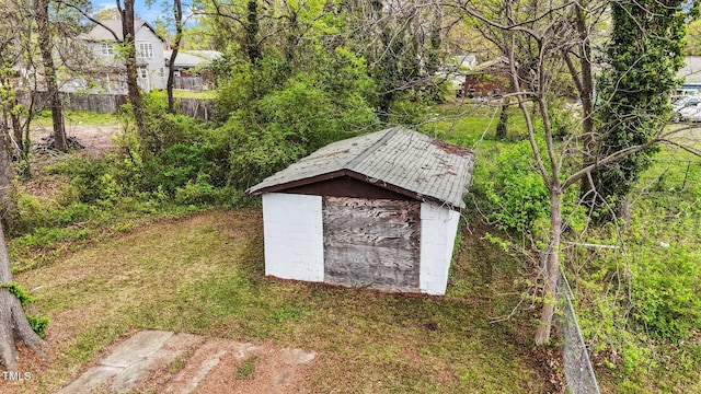 view of shed with fence
