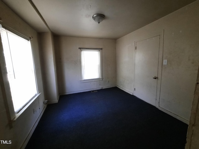 empty room with baseboards