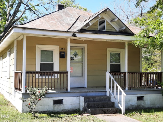 view of front of house with crawl space and covered porch