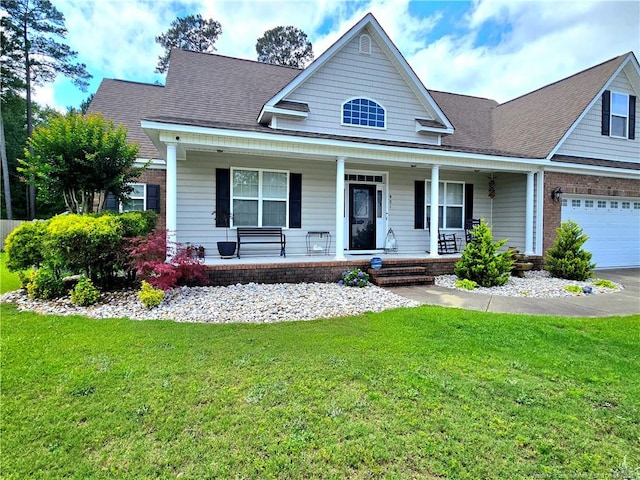 921 Satinwood Ct, Fayetteville, NC 28312 - view of front of property with a porch, a front yard, a shingled roof, and brick siding