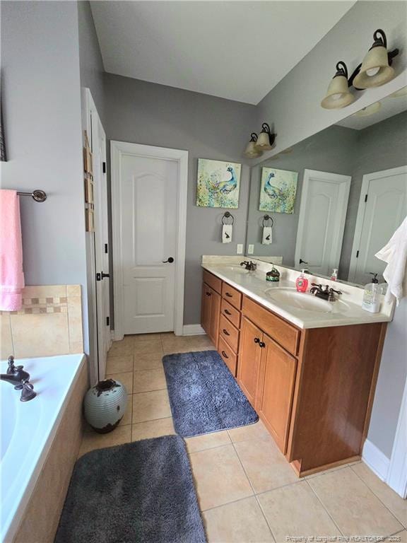 921 Satinwood Ct, Fayetteville, NC 28312 - full bathroom with double vanity, a bath, tile patterned flooring, and baseboards