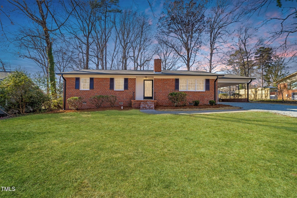 5013 Green Oak Dr, Durham, NC 27712 - single story home with a carport, a chimney, brick siding, a front lawn, and gravel driveway
