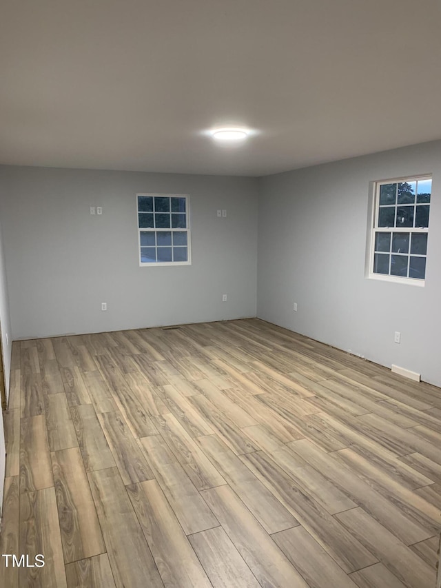 empty room with wood finished floors