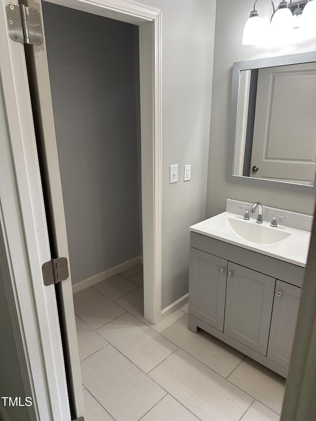 bathroom featuring vanity and baseboards