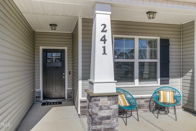 doorway to property with a porch