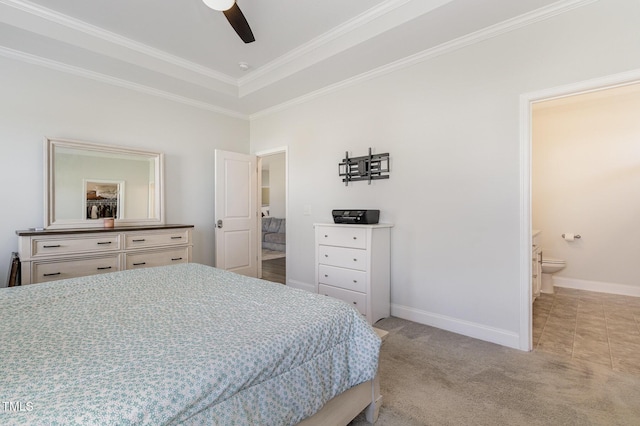carpeted bedroom featuring crown molding, baseboards, ceiling fan, and connected bathroom
