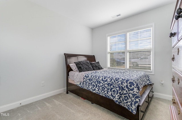 bedroom with light colored carpet, baseboards, and visible vents