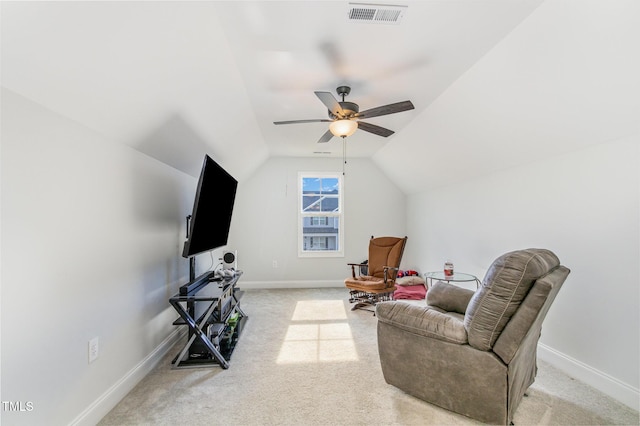 living area featuring light carpet, baseboards, lofted ceiling, and visible vents