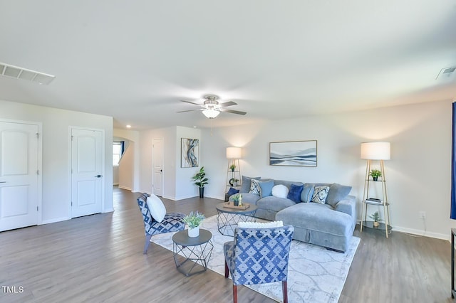 2065 Alderman Way, Creedmoor, NC 27522 - living room featuring wood finished floors, ceiling fan, baseboards, and visible vents