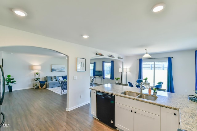 2065 Alderman Way, Creedmoor, NC 27522 - kitchen featuring white cabinets, arched walkways, dishwasher, a sink, and open floor plan