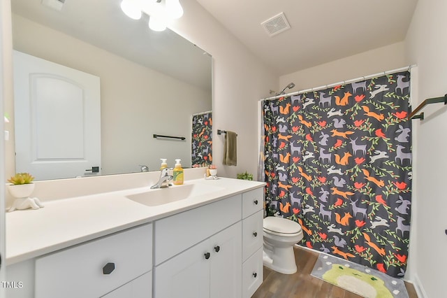 2065 Alderman Way, Creedmoor, NC 27522 - bathroom featuring visible vents, curtained shower, toilet, vanity, and wood finished floors