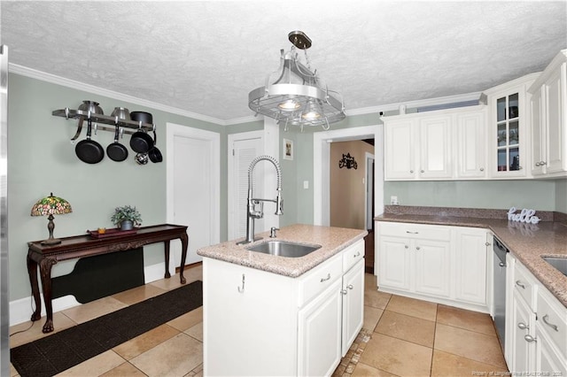 416 N Main St, Raeford, NC 28376 - kitchen with stainless steel dishwasher, an island with sink, glass insert cabinets, white cabinets, and a sink
