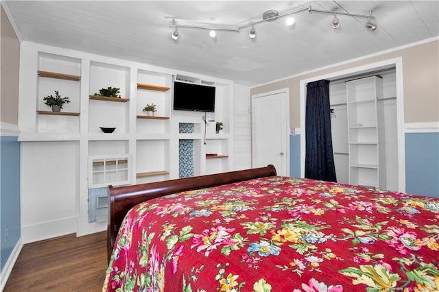 416 N Main St, Raeford, NC 28376 - bedroom with two closets, dark wood-style floors, and crown molding