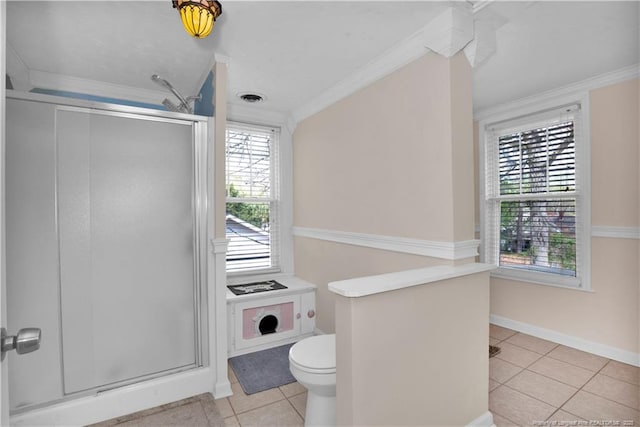 416 N Main St, Raeford, NC 28376 - full bathroom featuring baseboards, toilet, crown molding, tile patterned floors, and a stall shower