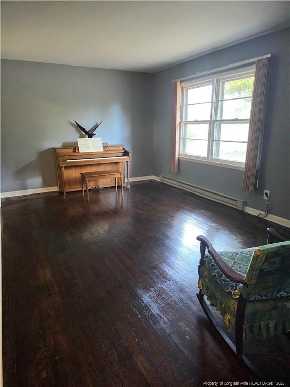 4017 Glenridge Rd, Fayetteville, NC 28304 - sitting room featuring a baseboard radiator, wood finished floors, and baseboards