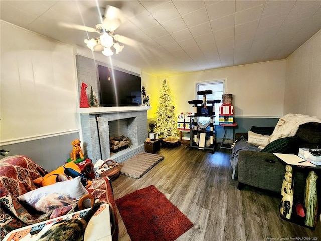 4017 Glenridge Rd, Fayetteville, NC 28304 - living area with wood finished floors, a brick fireplace, and wainscoting