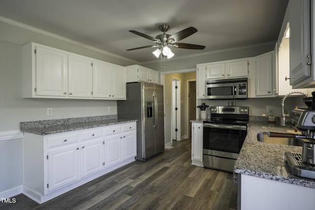 kitchen featuring a ceiling fan, white cabinetry, appliances with stainless steel finishes, and dark wood-style flooring