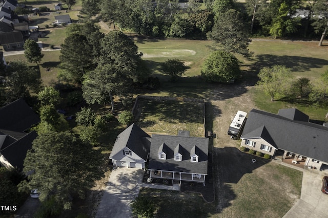 birds eye view of property with view of golf course