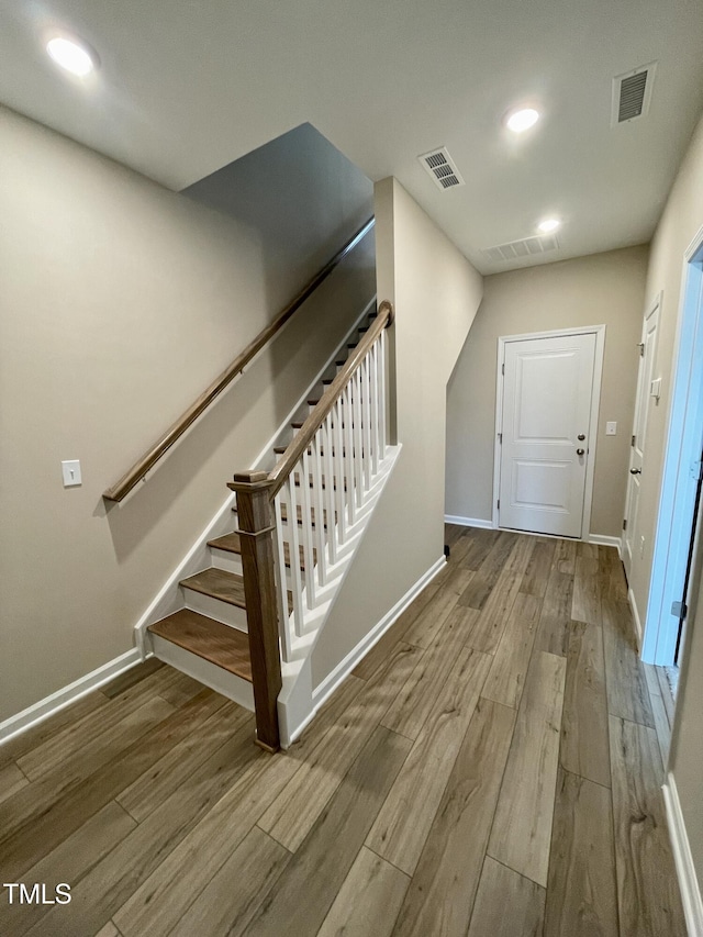 413 Diversity Way, Raleigh, NC 27610 - foyer with wood finished floors, baseboards, stairs, and recessed lighting