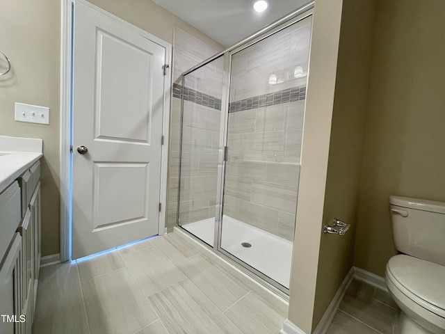 413 Diversity Way, Raleigh, NC 27610 - bathroom with toilet, a shower stall, vanity, and baseboards
