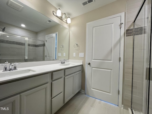 413 Diversity Way, Raleigh, NC 27610 - bathroom with a stall shower, double vanity, and tile patterned flooring