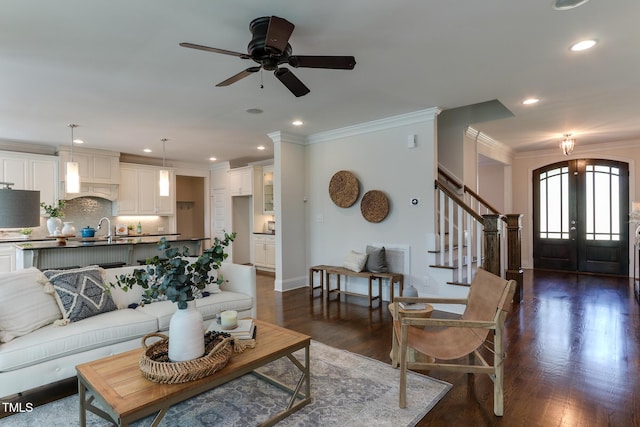 721 Shelley Rd, Raleigh, NC 27609 - living area with stairway, ceiling fan, ornamental molding, and dark wood-style floors