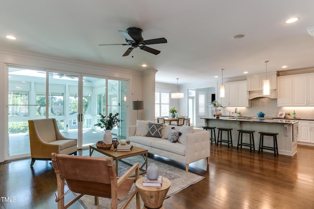 721 Shelley Rd, Raleigh, NC 27609 - living area featuring crown molding, recessed lighting, ceiling fan, and dark wood-style flooring