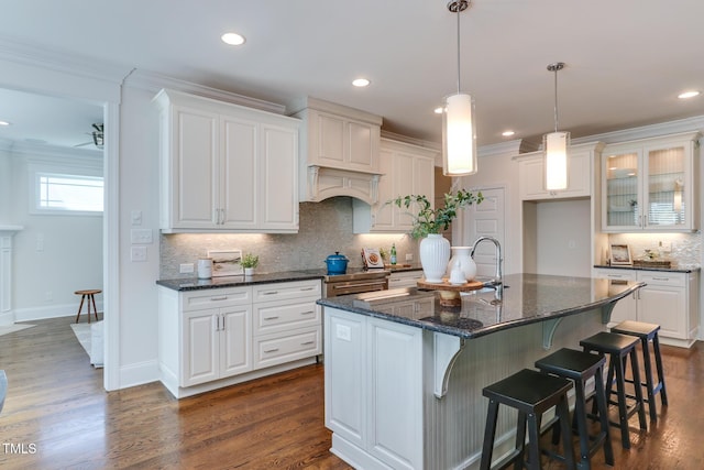 721 Shelley Rd, Raleigh, NC 27609 - kitchen featuring white cabinets, backsplash, and ornamental molding