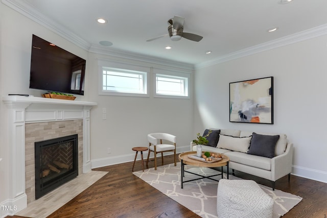 721 Shelley Rd, Raleigh, NC 27609 - living room with a tiled fireplace, crown molding, and baseboards
