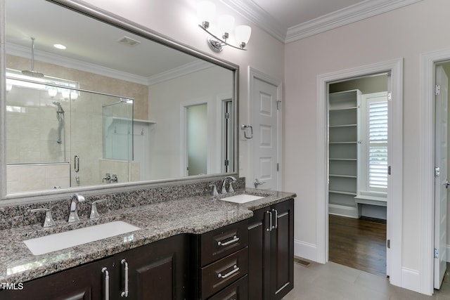 721 Shelley Rd, Raleigh, NC 27609 - full bathroom featuring visible vents, a sink, a shower stall, and double vanity