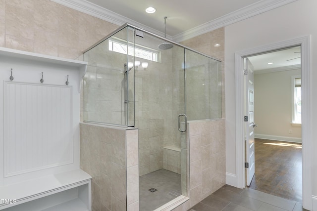 721 Shelley Rd, Raleigh, NC 27609 - bathroom featuring baseboards, tile patterned flooring, ornamental molding, and a stall shower