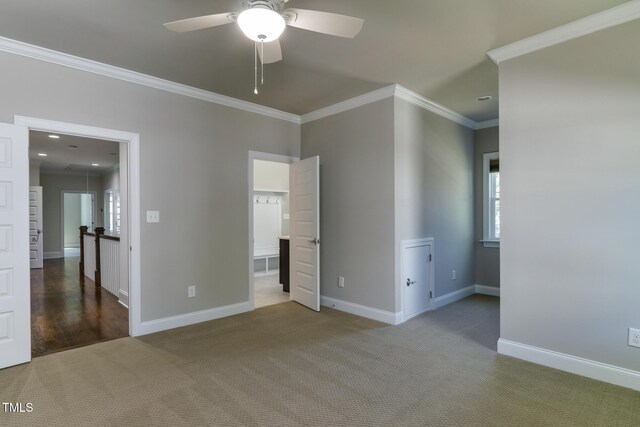 721 Shelley Rd, Raleigh, NC 27609 - unfurnished bedroom featuring crown molding, carpet flooring, baseboards, and a ceiling fan