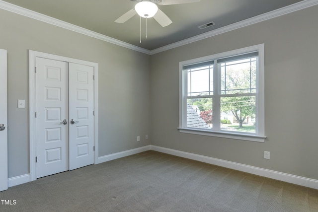 721 Shelley Rd, Raleigh, NC 27609 - carpeted empty room featuring ceiling fan, baseboards, crown molding, and visible vents