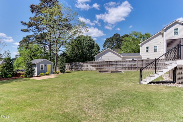 721 Shelley Rd, Raleigh, NC 27609 - view of yard featuring fence, an outbuilding, and stairs