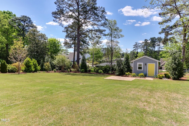 721 Shelley Rd, Raleigh, NC 27609 - view of yard with an outdoor structure and a patio