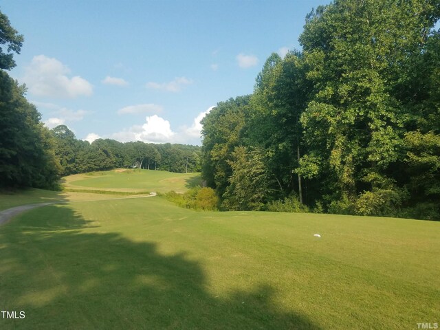 104 Chuckwagon Dr, Louisburg, NC 27549 - surrounding community with a lawn and view of golf course
