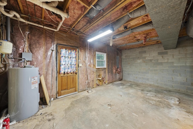 below grade area with electric water heater and electric panel
