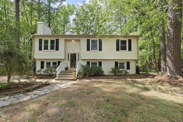 split foyer home with a chimney