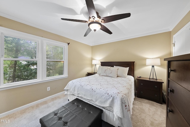 bedroom featuring ornamental molding, ceiling fan, baseboards, and light colored carpet