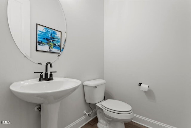 956 The Parks Dr, Pittsboro, NC 27312 - bathroom featuring toilet, baseboards, and wood finished floors
