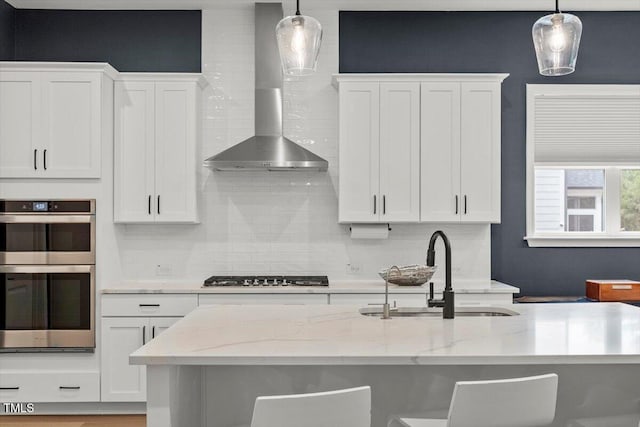 956 The Parks Dr, Pittsboro, NC 27312 - kitchen with wall chimney exhaust hood, a sink, backsplash, and appliances with stainless steel finishes