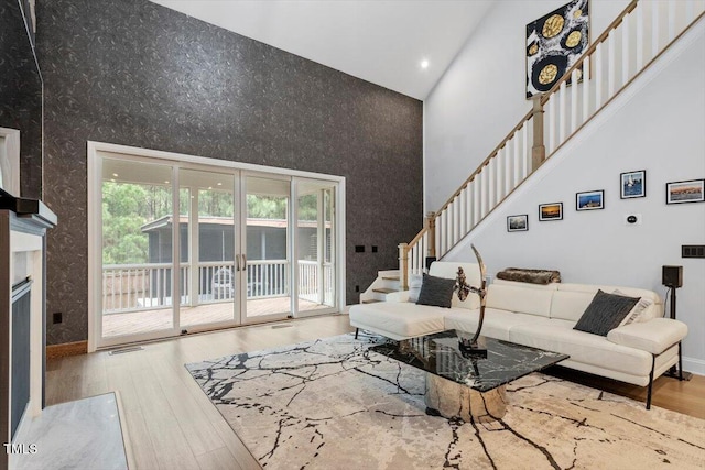 956 The Parks Dr, Pittsboro, NC 27312 - living room with a towering ceiling, visible vents, recessed lighting, stairway, and wood finished floors